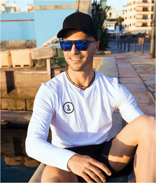 A photo of a man in sunglasses.