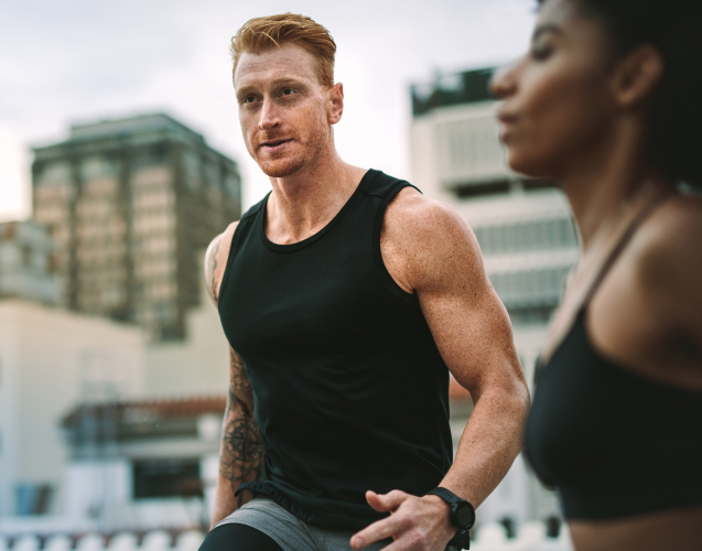 A photo of a man jogging.