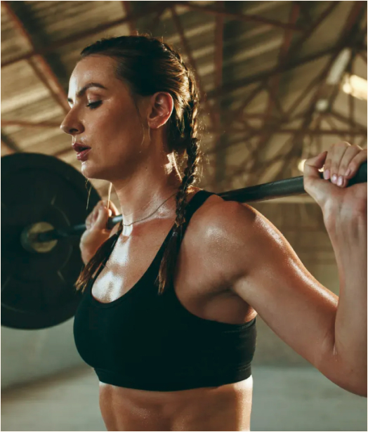 A photo of a woman doing weightlifting.